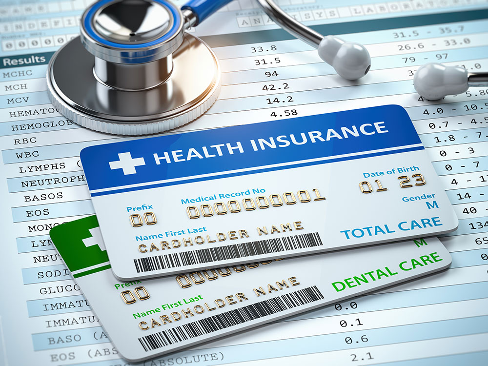 Health Insurance cards total and dental care with stethscope.